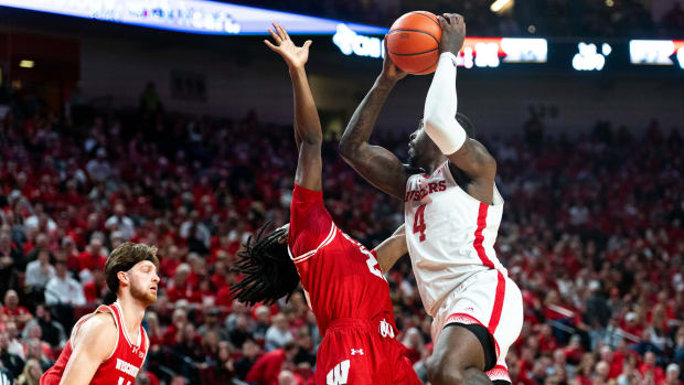 Feb 1, 2024; Lincoln, Nebraska, USA; Nebraska Cornhuskers forward Juwan Gary (4) shoots the ball against Wisconsin Badgers guard John Blackwell (25) during the first half at Pinnacle Bank Arena.